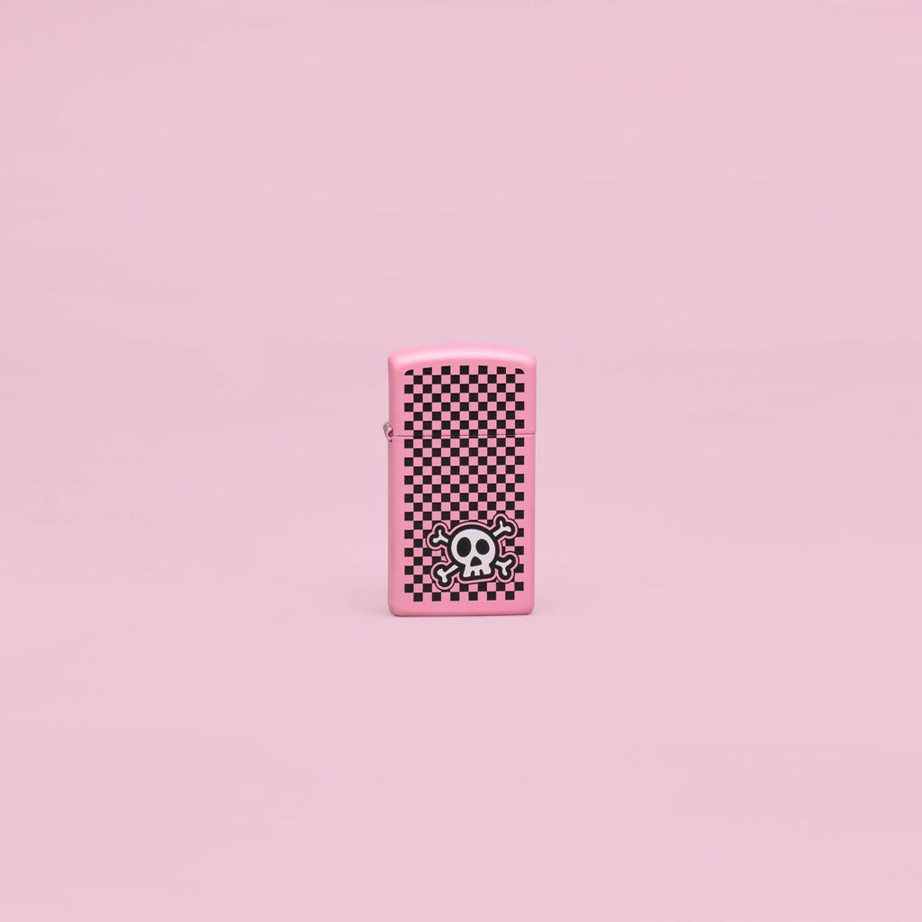 Lifestyle image of Zippo Checkered Skull Design Slim Pink Matte Windproof Lighter in a pink scene.