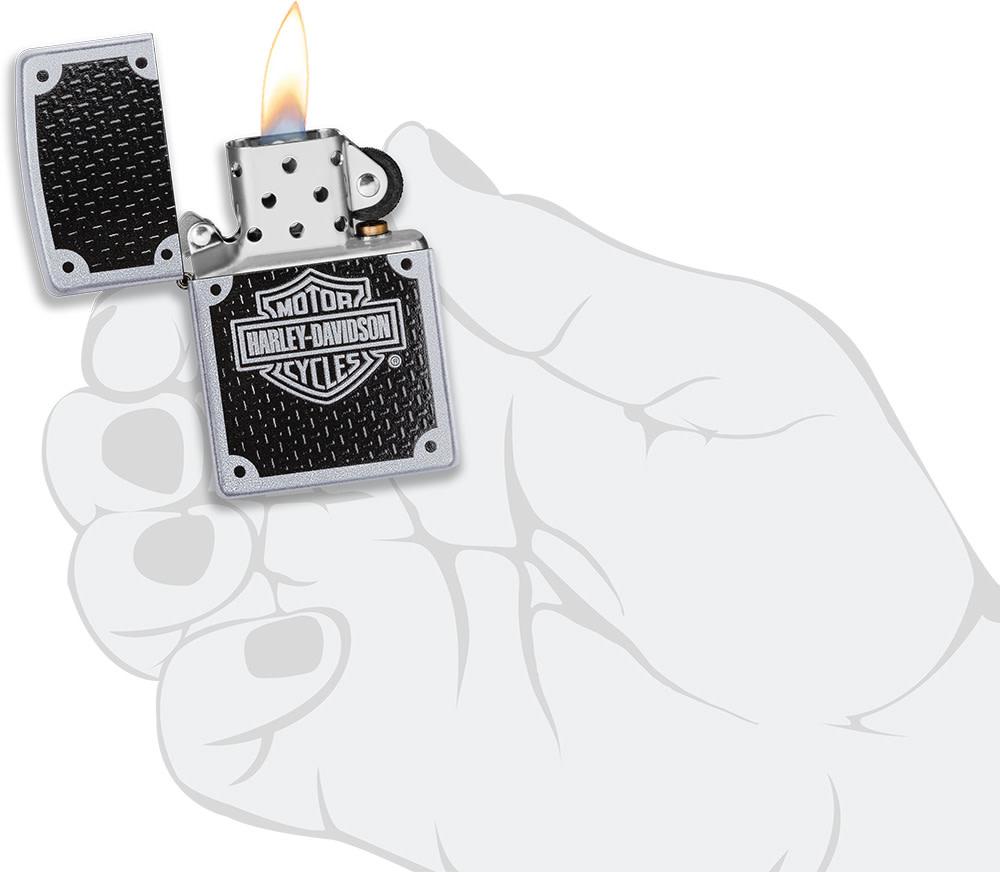 Harley-DavidsonÂ® Satin Chrome Windproof Lighter lit in hand