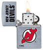 NHL New Jersey Devils Street Chrome™ Windproof Lighter with its lid open and lit