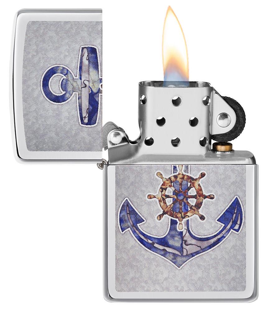 Anchor Design High Polish Chrome Windproof Lighter with its lid open and lit
