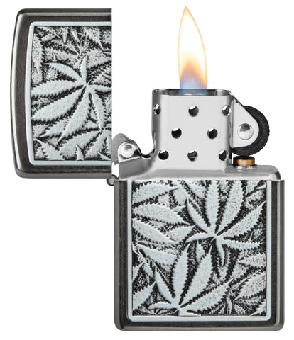 Cannabis Emblem Design Grey Windproof Lighter with its lid open and lit.