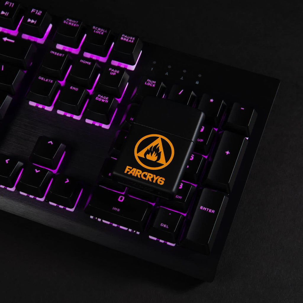 Lifestyle image of Far Cry® 6 Logo Black Matte Windproof Lighter laying on an illuminated gaming keyboard.