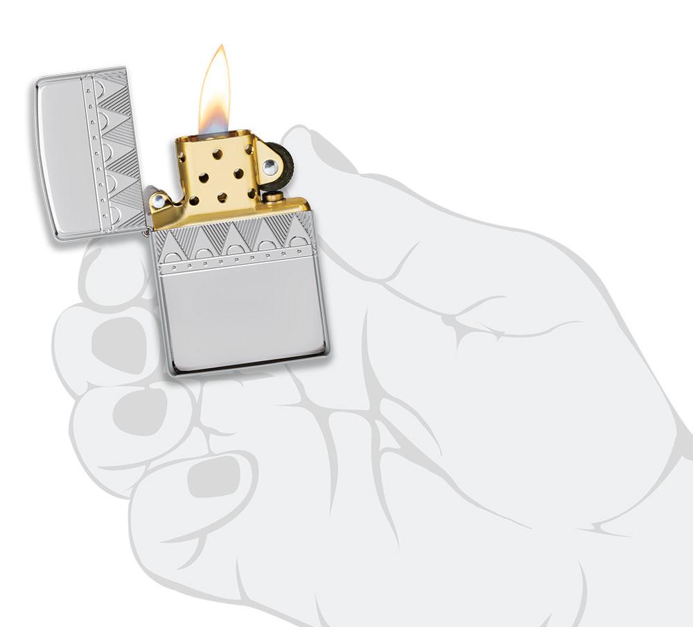 ArmorÂ® Sterling Silver Diamond Pattern Design Windproof Lighter lit in hand