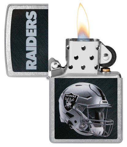 NFL Las Vegas Raiders Helmet Street Chrome Windproof Lighter with its lid open and lit.