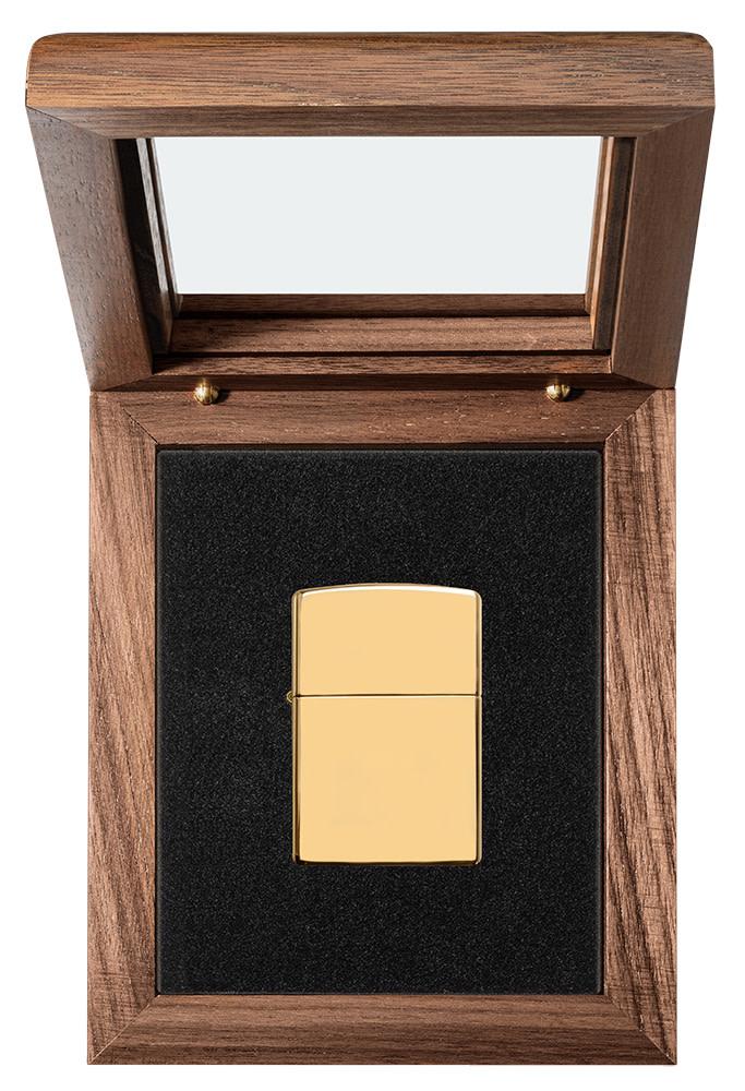 ArmorÂ® High Polish 18K Solid Gold Windproof Lighter in its luxury packaging.