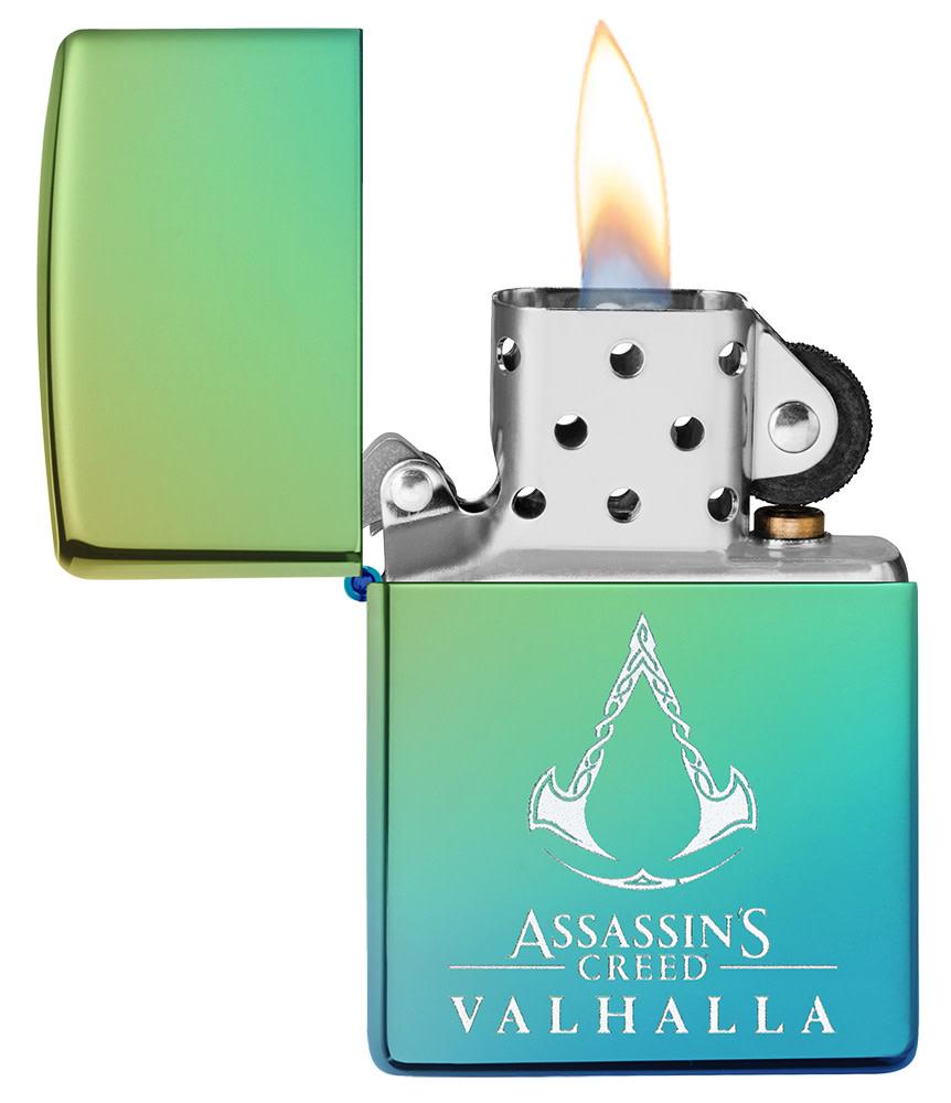 Assassin's Creed® Valhalla Logo High Polish Teal Windproof Lighter with its lid open and lit.