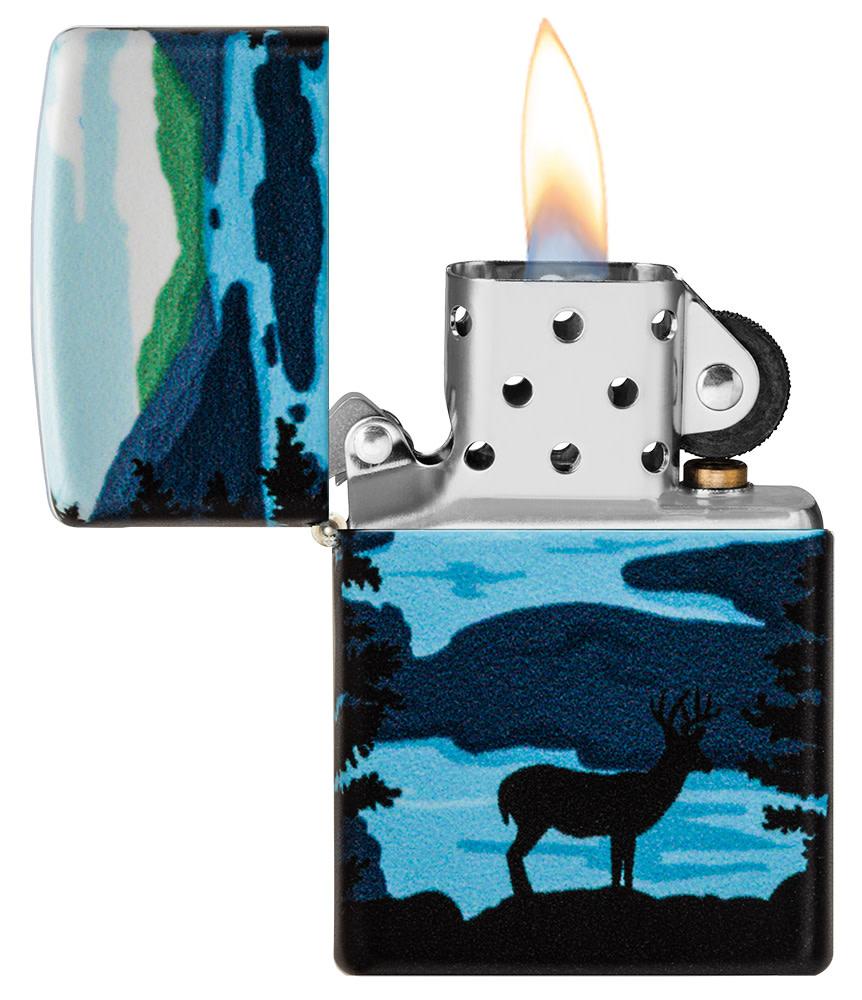 Deer Landscape Design 540 Color Windproof Lighter with its lid open and lit